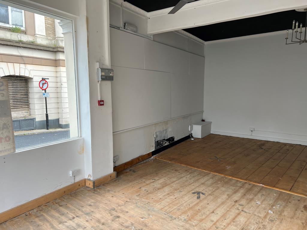 Lot: 47 - TWO STOREY TOWN CENTRE COMMERCIAL PREMISES - The Side and Rear of the Shop